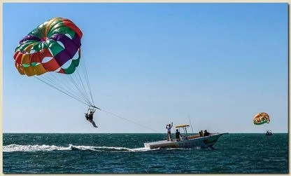 Water trampoline, banana boat, and jet ski in the sparkling turquoise waters of Key West